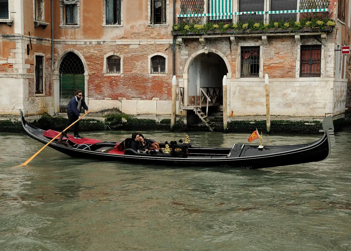 A gondolier rowing on the Grand Canal